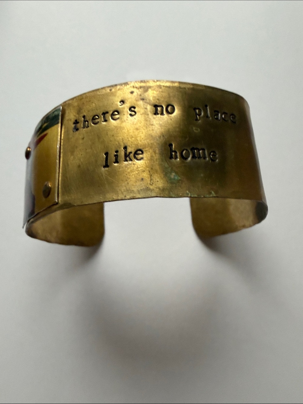Bronze imprinted “there’s no place like home” bendable bracelet